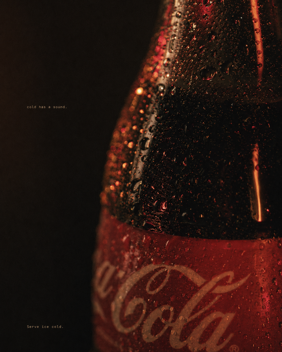 Macro of the Coca-Cola bottle — condensation, the curve of the cap, neon glow